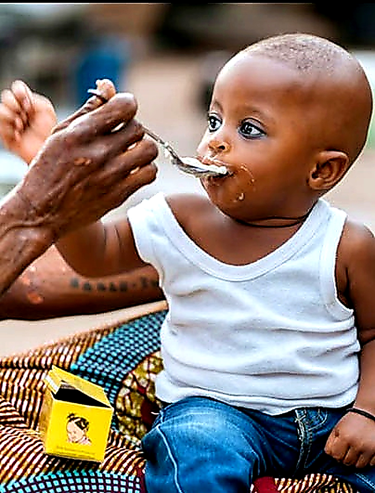 Young child being fed